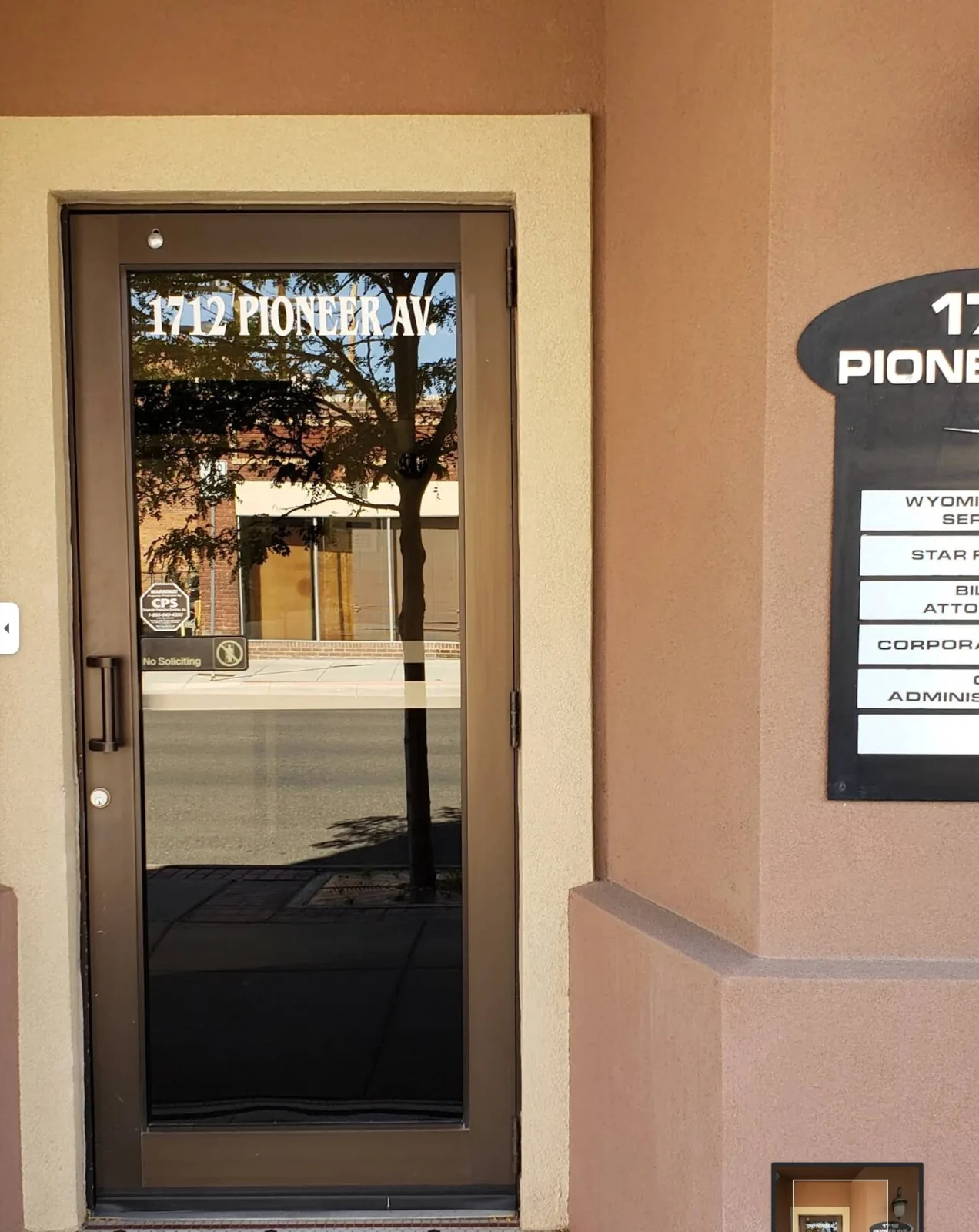 AC55ID Acid Nation registered-office address-layer WebP exhibit showing a public door and directory view for 1712 Pioneer Ave with no reporting-side identifiers.