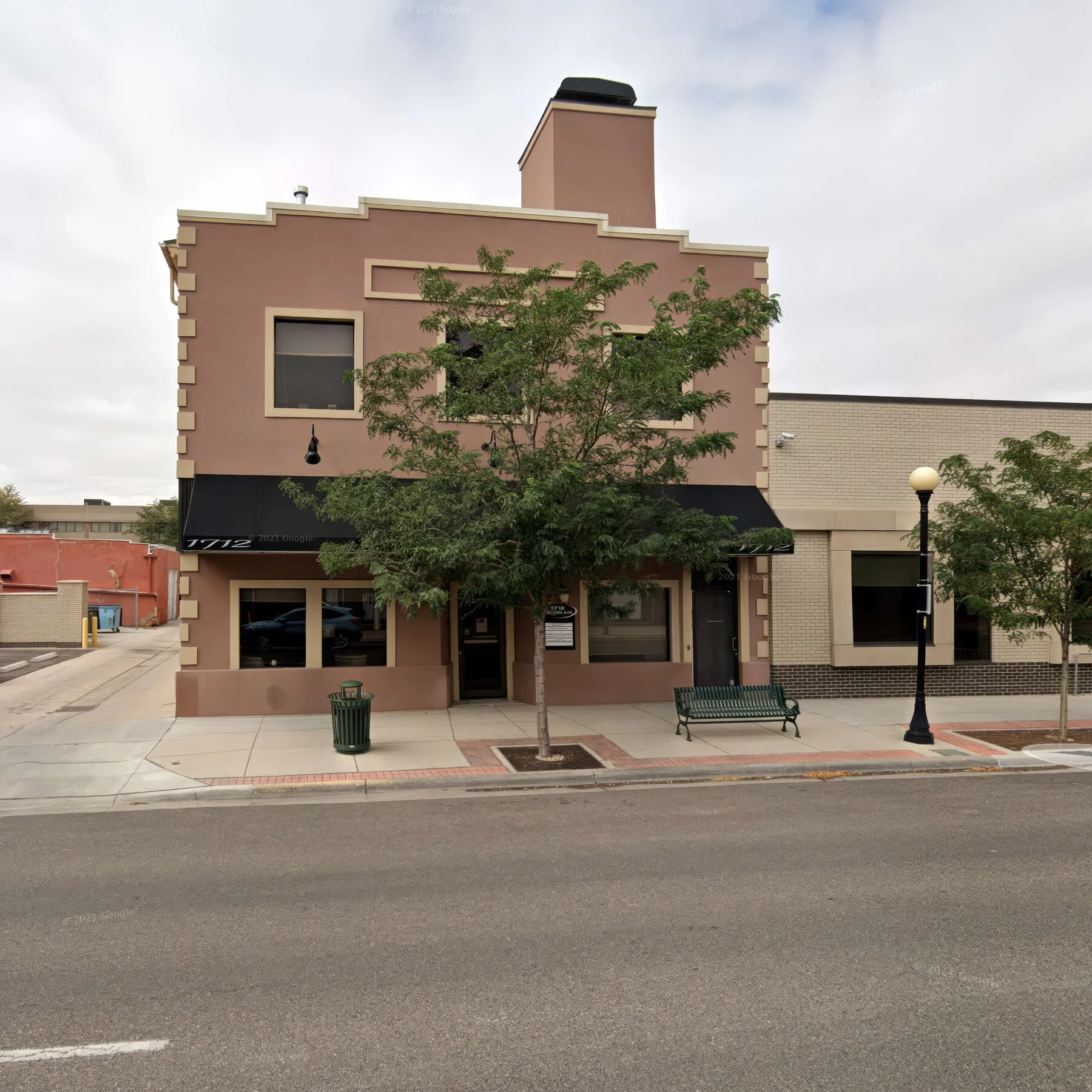 AC55ID Acid Nation registered-office address-layer WebP exhibit showing the street-level exterior context of 1712 Pioneer Ave with no private reporting-side identifiers.